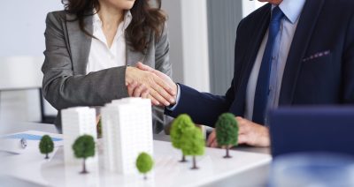 Close up of business partners shaking hands Close up of business partners shaking hands